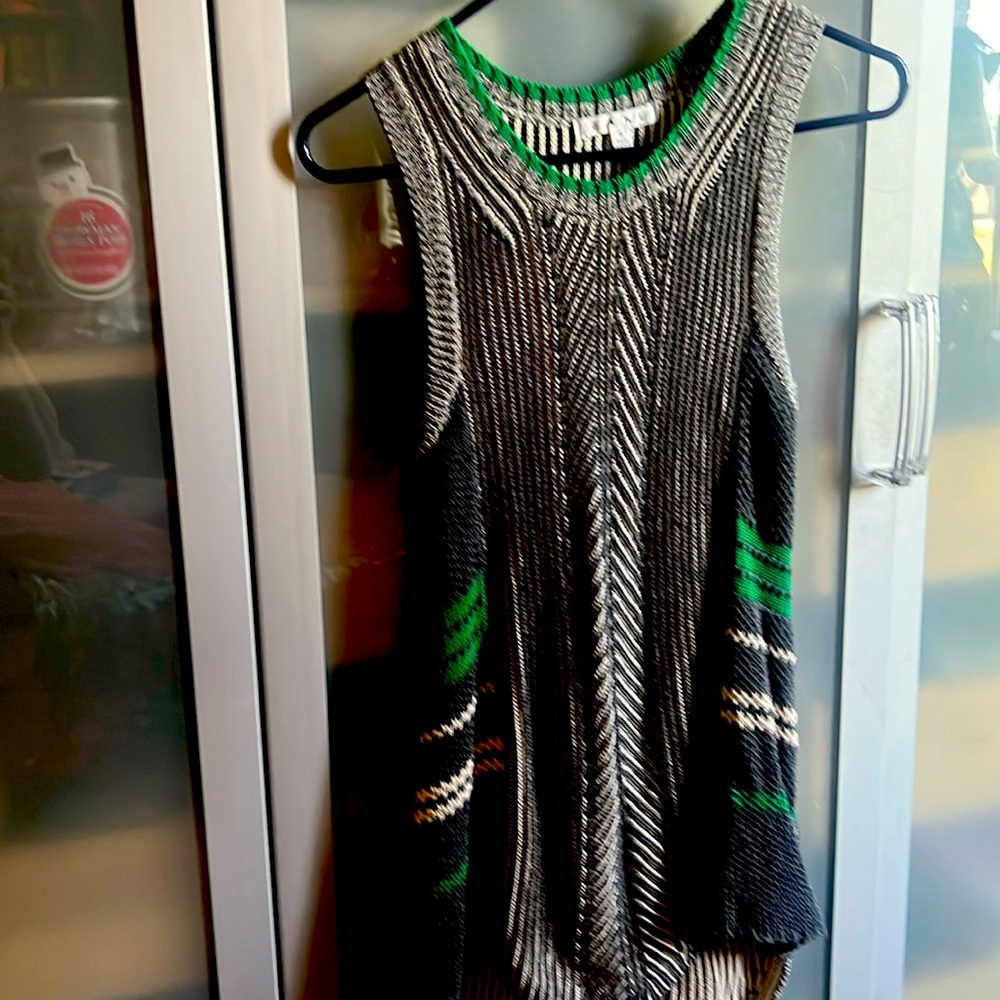 Cabi size small tunic top whereby itself or underneath a blazer. Has  stretch.
